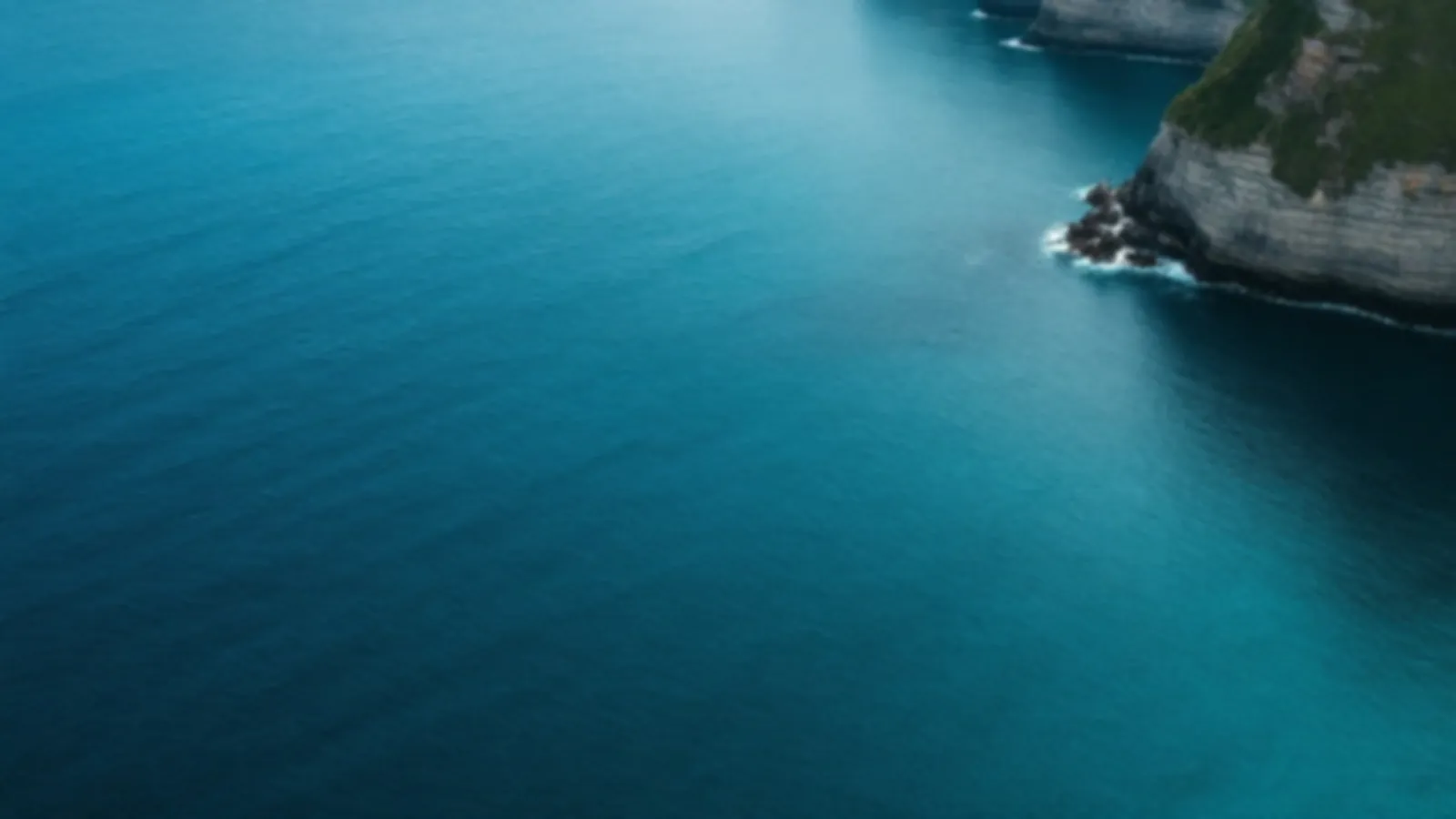 Tall green sea bluffs above a calm turquoise cove at sunrise, the BluffWallet view of bad credit loans online, $100 – $5,000